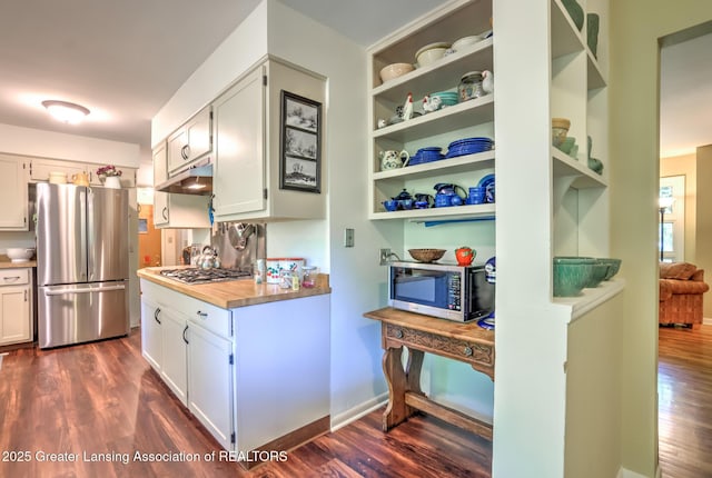 4451 Greenwood Dr, Okemos, MI 48864 - kitchen featuring stainless steel appliances, dark wood-style flooring, white cabinetry, under cabinet range hood, and open shelves