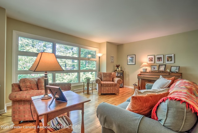 4451 Greenwood Dr, Okemos, MI 48864 - living area with a baseboard radiator and light wood finished floors