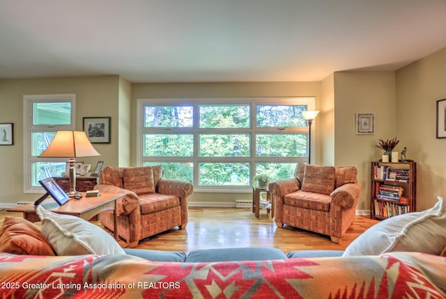 4451 Greenwood Dr, Okemos, MI 48864 - living area with wood finished floors and a baseboard heating unit