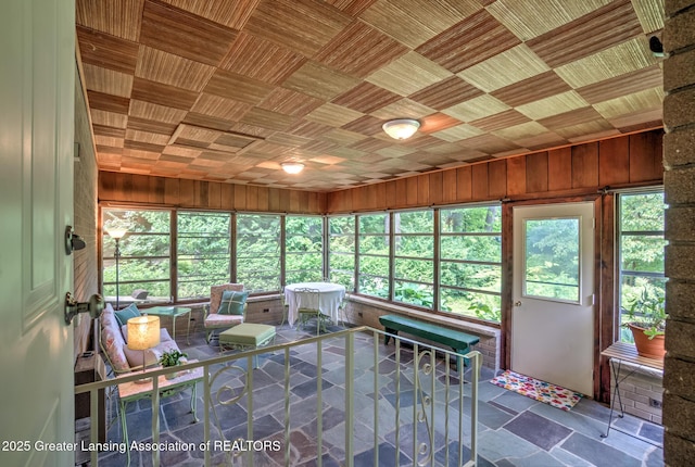 4451 Greenwood Dr, Okemos, MI 48864 - sunroom featuring wood walls and stone finish flooring