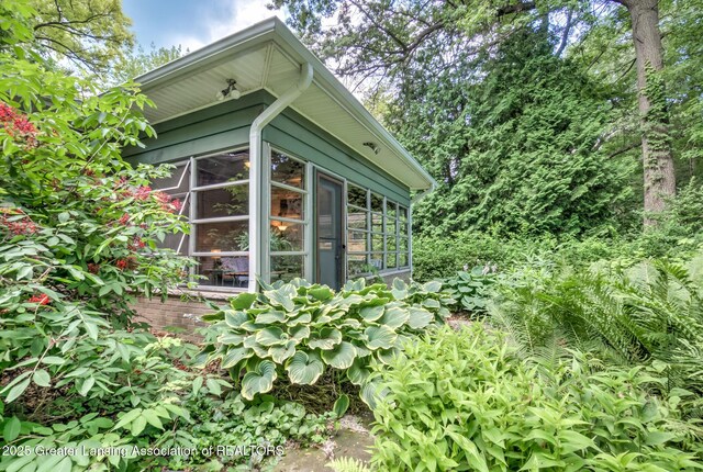 4451 Greenwood Dr, Okemos, MI 48864 - view of side of property featuring a sunroom
