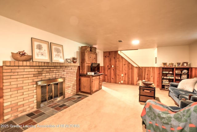 4451 Greenwood Dr, Okemos, MI 48864 - living room with wooden walls, a brick fireplace, and carpet floors