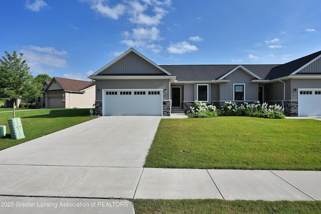 330 Vansickle Dr Unit 31, Charlotte, MI 48813 - view of front of home with board and batten siding, stone siding, an attached garage, and a front lawn