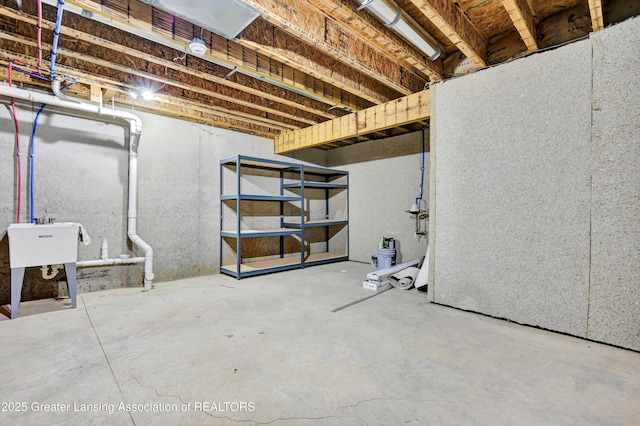 330 Vansickle Dr Unit 31, Charlotte, MI 48813 - unfinished basement featuring a sink