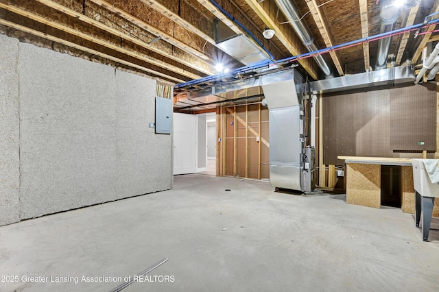 330 Vansickle Dr Unit 31, Charlotte, MI 48813 - unfinished below grade area with heating unit and electric panel