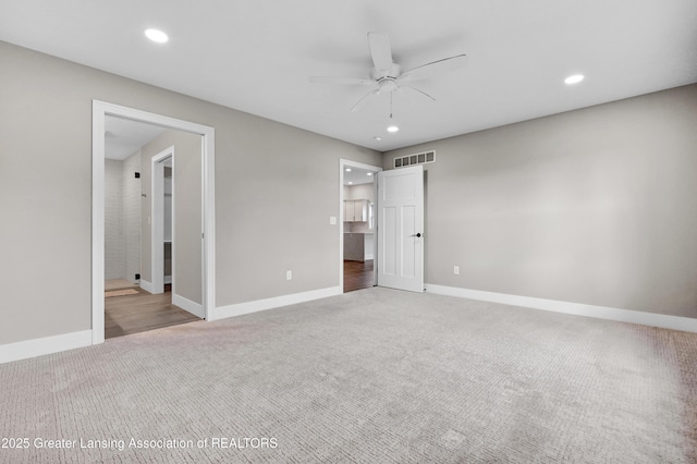 330 Vansickle Dr Unit 31, Charlotte, MI 48813 - unfurnished bedroom featuring carpet, recessed lighting, and ensuite bathroom
