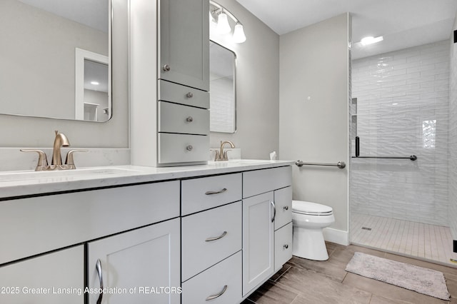 330 Vansickle Dr Unit 31, Charlotte, MI 48813 - bathroom with double vanity and a stall shower