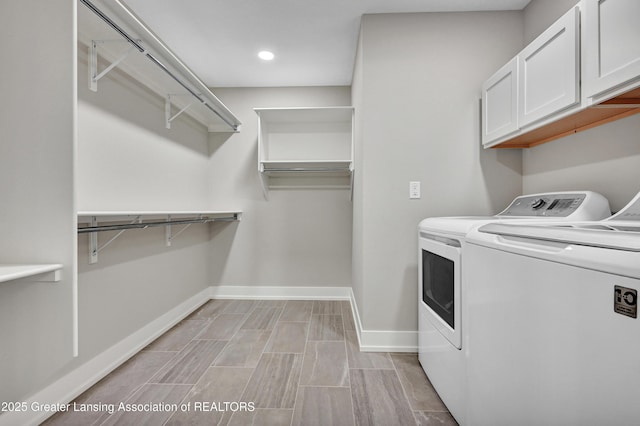 330 Vansickle Dr Unit 31, Charlotte, MI 48813 - laundry room featuring washing machine and clothes dryer, cabinet space, and recessed lighting