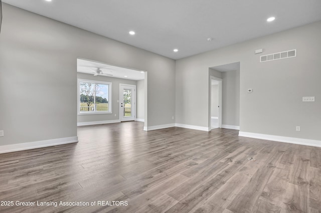 330 Vansickle Dr Unit 31, Charlotte, MI 48813 - unfurnished living room with recessed lighting, wood finished floors, and ceiling fan