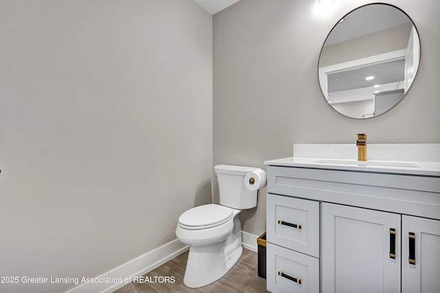 330 Vansickle Dr Unit 31, Charlotte, MI 48813 - half bath featuring vanity and wood finished floors