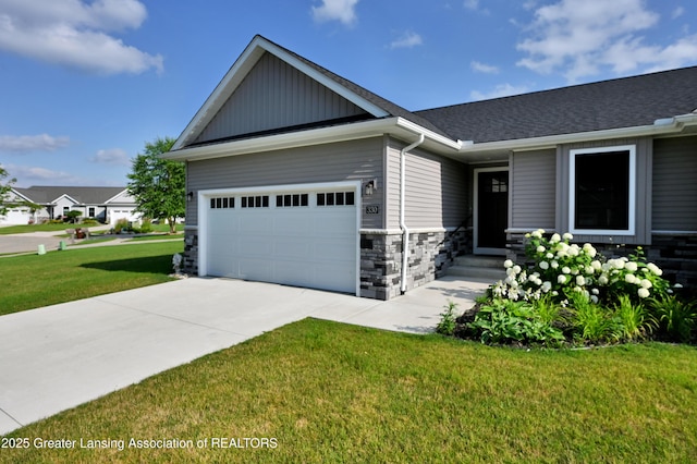 330 Vansickle Dr Unit 31, Charlotte, MI 48813 - craftsman-style home featuring driveway, an attached garage, a front yard, stone siding, and board and batten siding