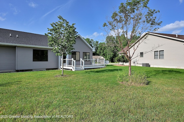330 Vansickle Dr Unit 31, Charlotte, MI 48813 - view of green lawn with a deck