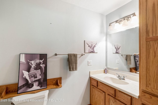 26 Aviemore Dr, Mason, MI 48854 - bathroom with vanity and toilet