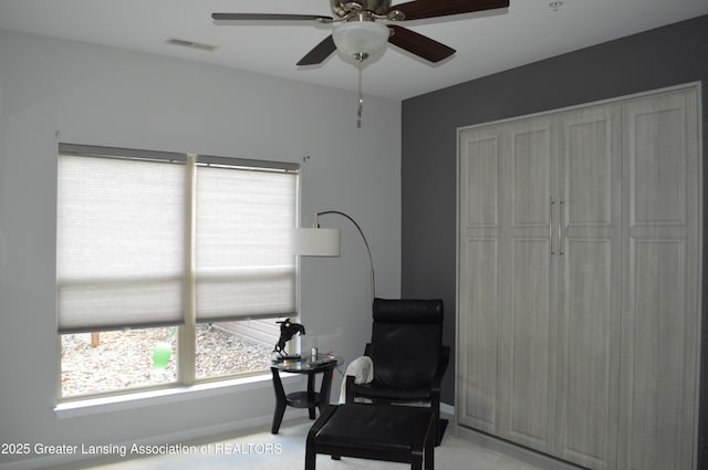 3706 Flying Gulch Dr, Holt, MI 48842 - living area featuring light colored carpet, ceiling fan, and an office area