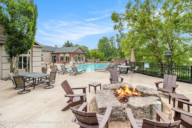 3706 Flying Gulch Dr, Holt, MI 48842 - view of patio / terrace featuring a fire pit