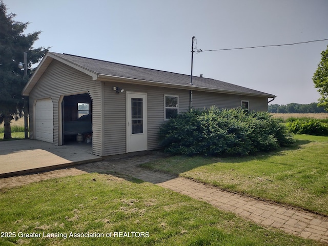 16711 Stark Rd, Springport, MI 49284 - view of home's exterior with a lawn and an outbuilding