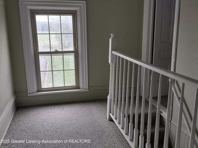 16711 Stark Rd, Springport, MI 49284 - hall with plenty of natural light, an upstairs landing, and carpet floors