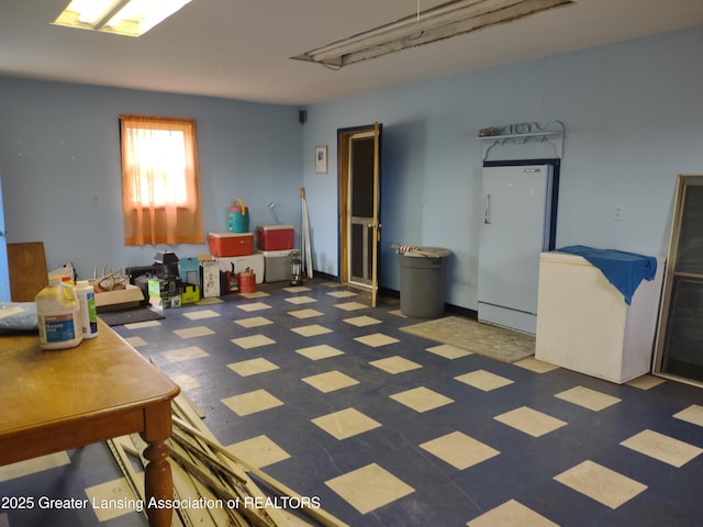 16711 Stark Rd, Springport, MI 49284 - basement with freestanding refrigerator and tile patterned floors