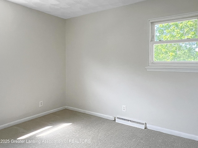 3500 S Catherine St, Lansing, MI 48911 - unfurnished room with carpet flooring and a baseboard heating unit