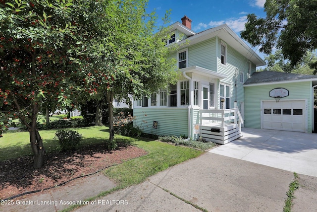 302 E State St, Saint Johns, MI 48879 - view of front of property with a garage, a chimney, concrete driveway, and a front lawn