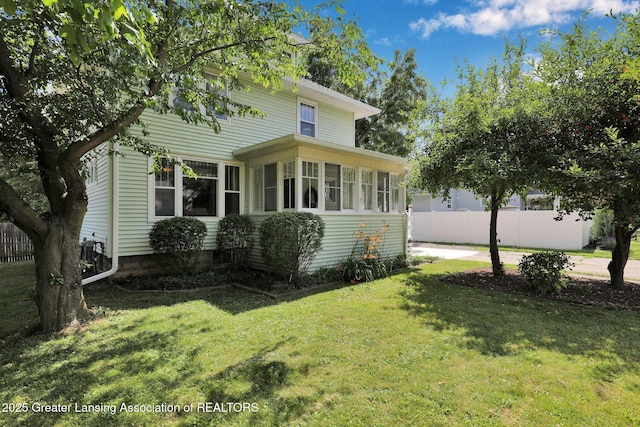 302 E State St, Saint Johns, MI 48879 - view of home's exterior featuring a sunroom