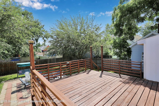 302 E State St, Saint Johns, MI 48879 - deck with a fenced backyard and a jacuzzi