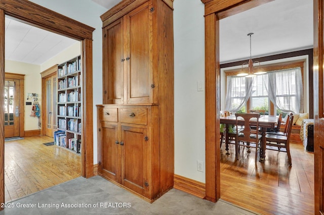 302 E State St, Saint Johns, MI 48879 - corridor with baseboards and light wood finished floors