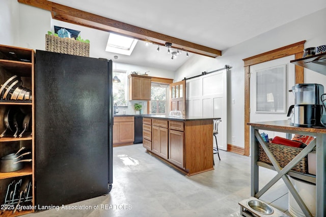 302 E State St, Saint Johns, MI 48879 - kitchen featuring black appliances, a kitchen island, dark countertops, a breakfast bar, and a barn door