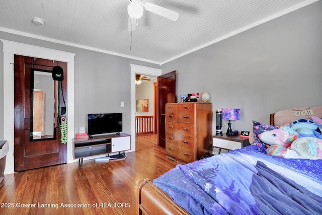 302 E State St, Saint Johns, MI 48879 - bedroom with wood finished floors, a ceiling fan, and ornamental molding
