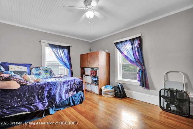302 E State St, Saint Johns, MI 48879 - bedroom featuring wood finished floors, ornamental molding, and ceiling fan