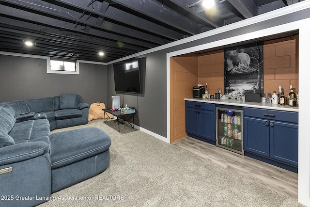 2818 Almar Ln, Lansing, MI 48910 - living room with wine cooler, bar, and light wood-style floors