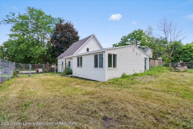 625 W Jefferson St, Grand Ledge, MI 48837 - view of property exterior with a fenced backyard
