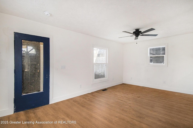625 W Jefferson St, Grand Ledge, MI 48837 - empty room with wood finished floors, a ceiling fan, and a smoke detector