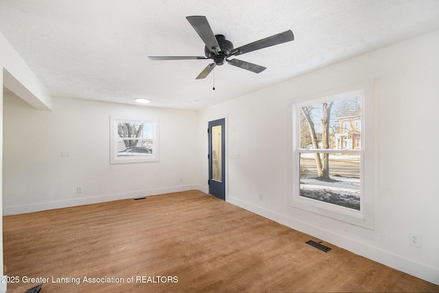 625 W Jefferson St, Grand Ledge, MI 48837 - empty room with light wood-style flooring and a ceiling fan