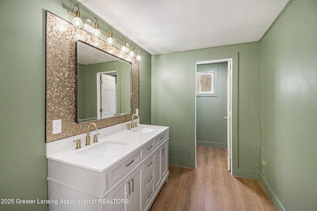 625 W Jefferson St, Grand Ledge, MI 48837 - bathroom with double vanity and wood finished floors