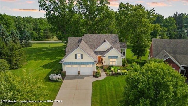 3537 Winborn Dr, Dewitt, MI 48820 - view of front of house with a yard, driveway, and a garage