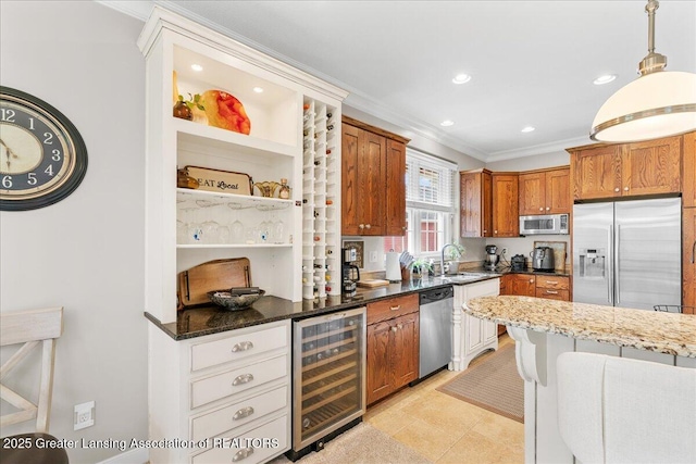 3537 Winborn Dr, Dewitt, MI 48820 - kitchen featuring appliances with stainless steel finishes, wine cooler, brown cabinets, ornamental molding, and hanging light fixtures