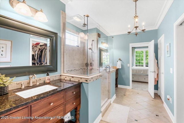 3537 Winborn Dr, Dewitt, MI 48820 - ensuite bathroom featuring ornamental molding, a stall shower, vanity, tile patterned floors, and a chandelier