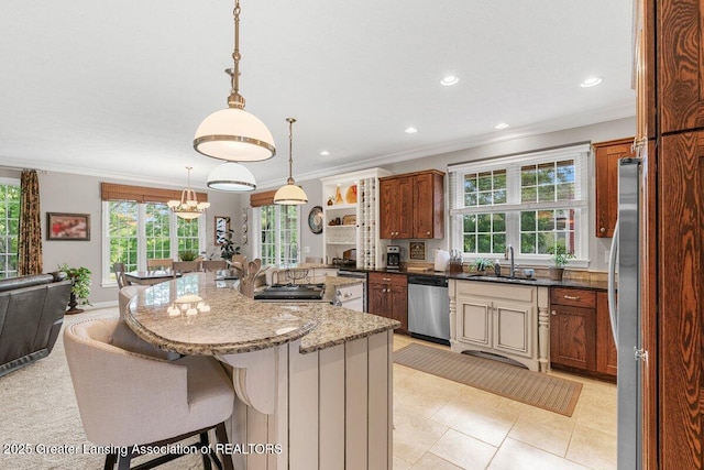 3537 Winborn Dr, Dewitt, MI 48820 - kitchen featuring appliances with stainless steel finishes, ornamental molding, a kitchen breakfast bar, recessed lighting, and open floor plan