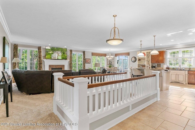 3537 Winborn Dr, Dewitt, MI 48820 - living area with crown molding, a brick fireplace, and recessed lighting