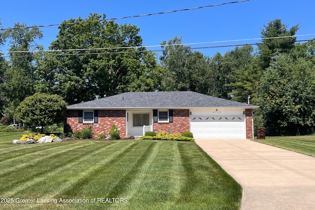 6716 Bunker Hill Dr, Lansing, MI 48906 - ranch-style house with an attached garage, a front lawn, brick siding, driveway, and roof with shingles