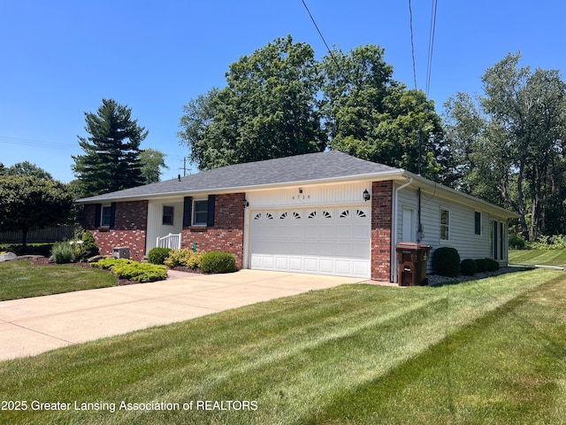 6716 Bunker Hill Dr, Lansing, MI 48906 - single story home featuring an attached garage, brick siding, a front yard, and driveway
