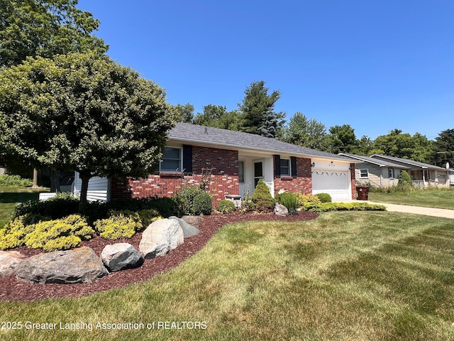 6716 Bunker Hill Dr, Lansing, MI 48906 - view of front of house with brick siding, an attached garage, and a front lawn