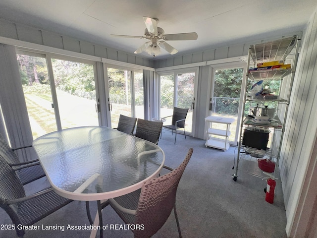 6716 Bunker Hill Dr, Lansing, MI 48906 - sunroom / solarium featuring ceiling fan and outdoor dining area