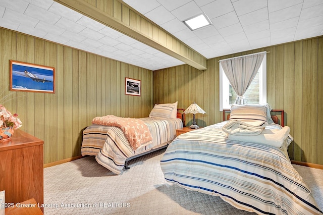 6716 Bunker Hill Dr, Lansing, MI 48906 - carpeted bedroom featuring wood walls