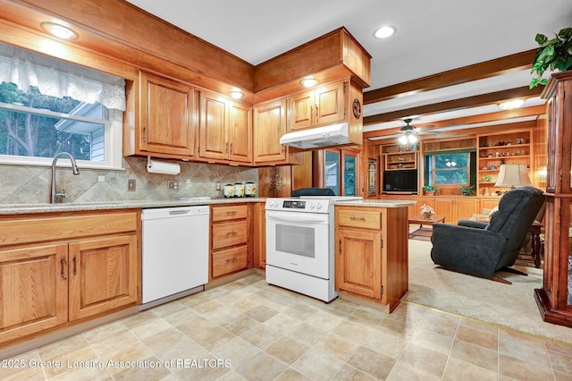 6716 Bunker Hill Dr, Lansing, MI 48906 - kitchen featuring white appliances, under cabinet range hood, a peninsula, open floor plan, and tasteful backsplash