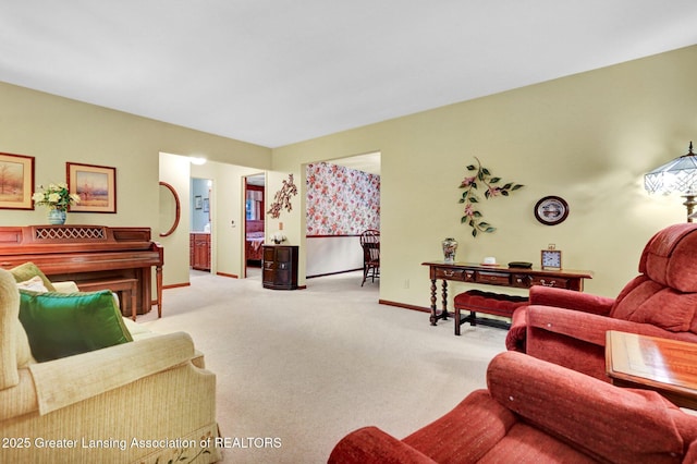 6716 Bunker Hill Dr, Lansing, MI 48906 - living room featuring carpet flooring and baseboards