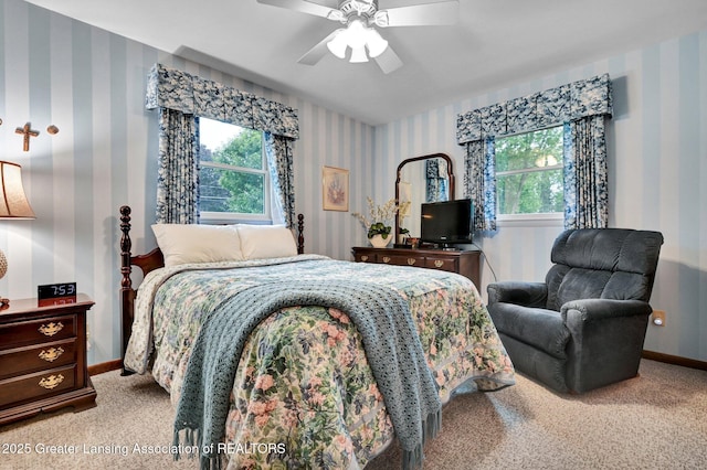 6716 Bunker Hill Dr, Lansing, MI 48906 - bedroom featuring wallpapered walls, carpet flooring, multiple windows, and a ceiling fan