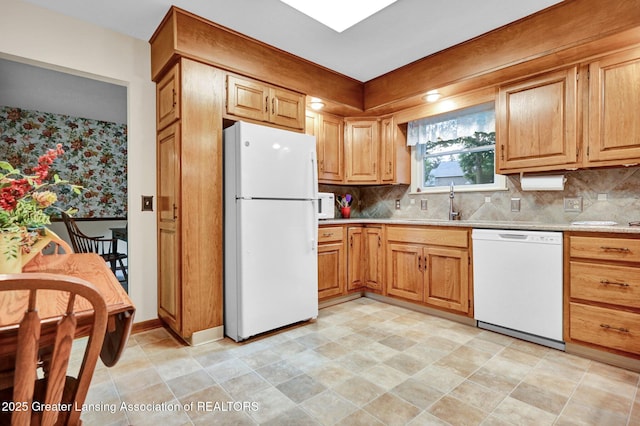 6716 Bunker Hill Dr, Lansing, MI 48906 - kitchen with white appliances and backsplash