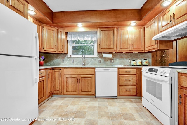 6716 Bunker Hill Dr, Lansing, MI 48906 - kitchen with white appliances, under cabinet range hood, backsplash, and brown cabinetry